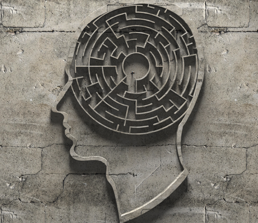 Illustration showing a human head in profile containing a circular maze, in 3d relief on a concrete texture background.